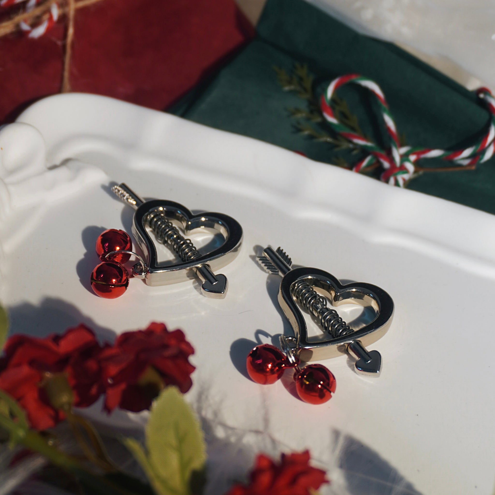 Reveriee Cupid’s Blade Nipple Clamps | Stainless Steel Clamps with Red Jingle Bells